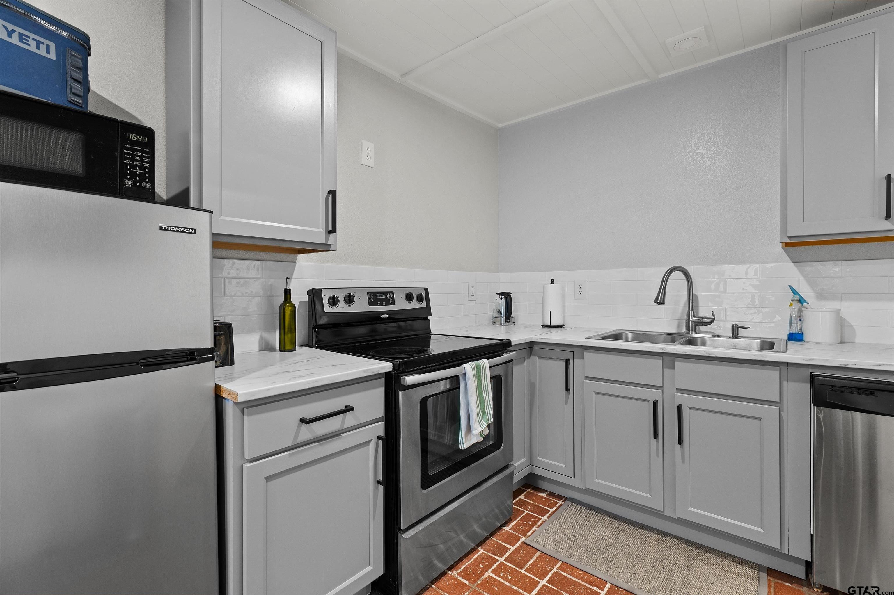 16 Pegues Place Longview, TX 75601 - Photo 40 of 45 a kitchen with a sink and steel appliances
