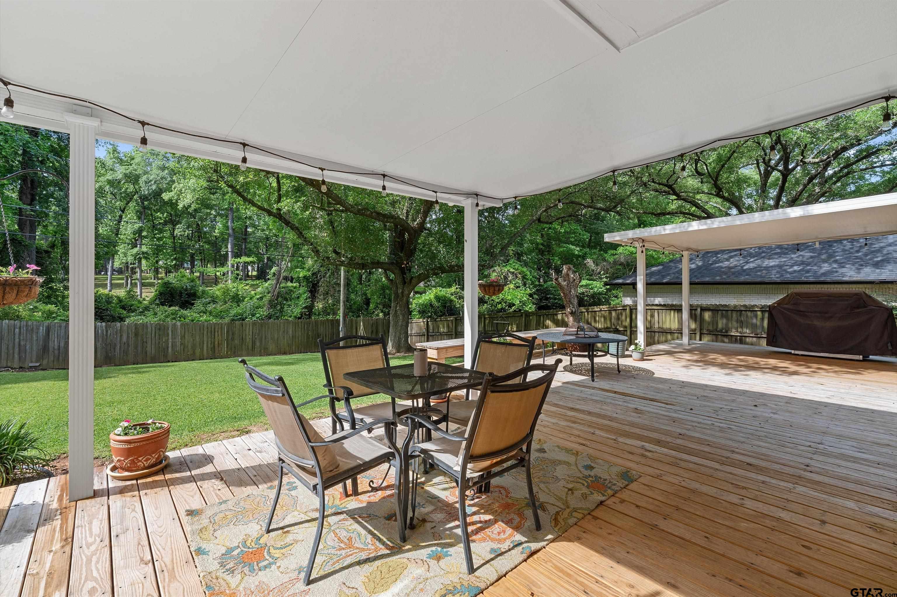 16 Pegues Place Longview, TX 75601 - Photo 44 of 45 a patio with yard table and chairs
