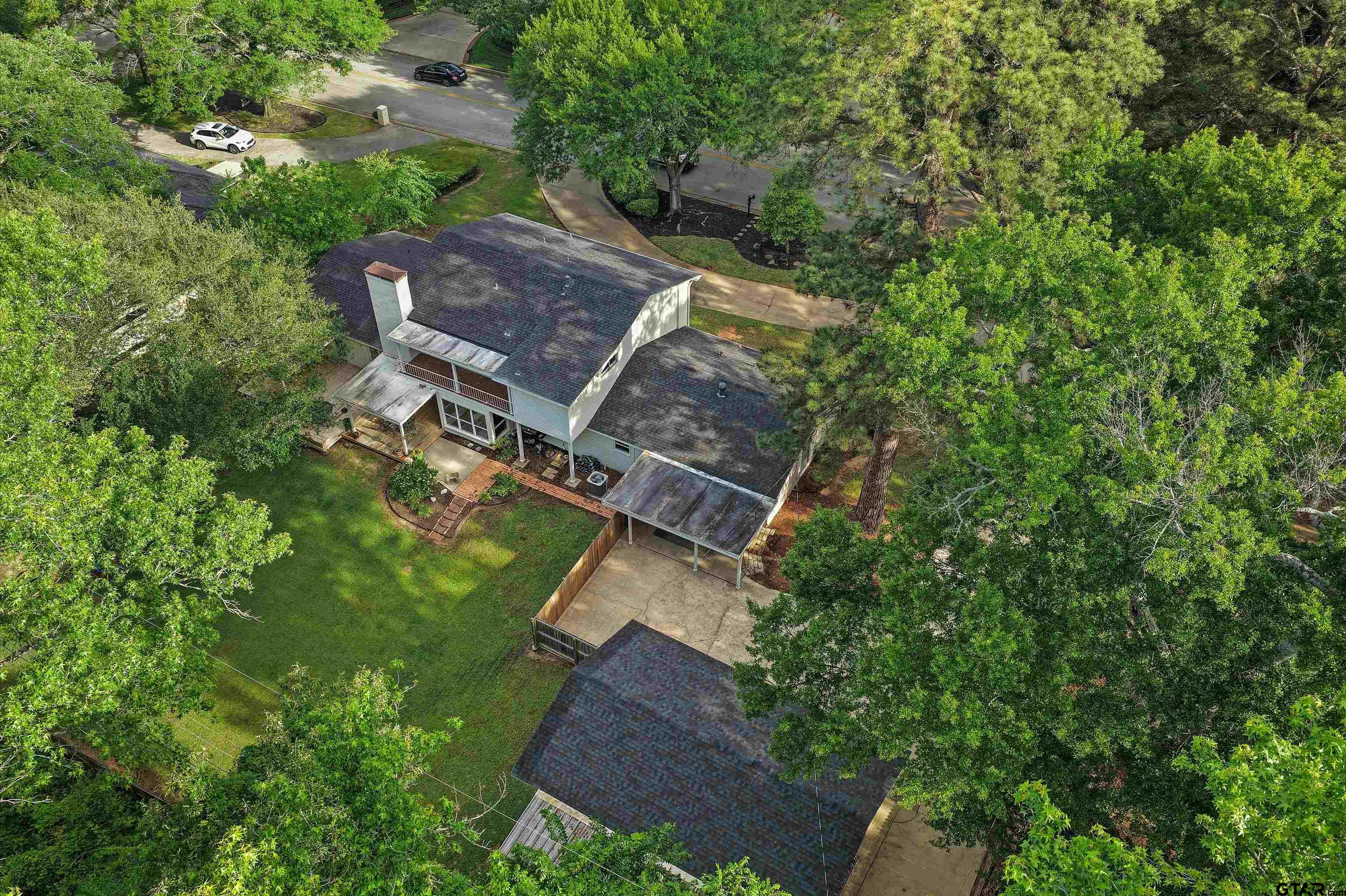 16 Pegues Place Longview, TX 75601 - Photo 5 of 45 an aerial view of a house with a yard