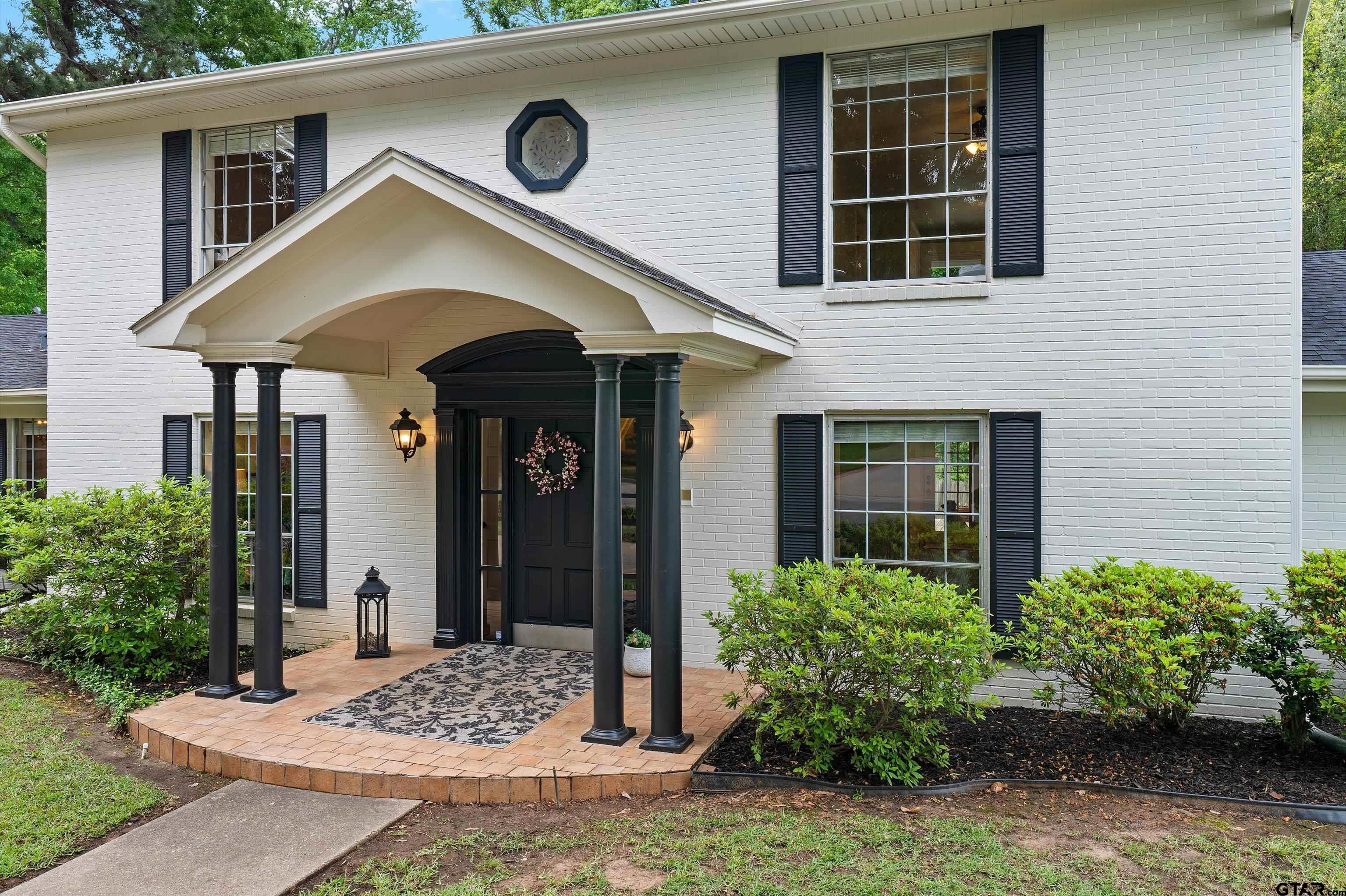 16 Pegues Place Longview, TX 75601 - Photo 10 of 45 a front view of a house with garden