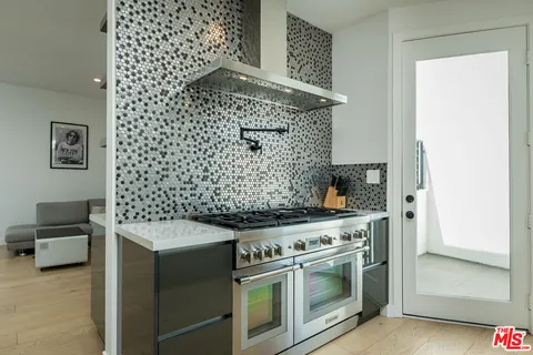 a kitchen with a stove and a microwave