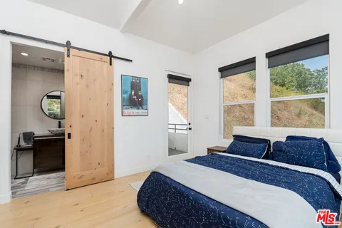 a bathroom with a sink a shower and a mirror