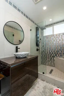 a spacious bedroom with a bed and furniture