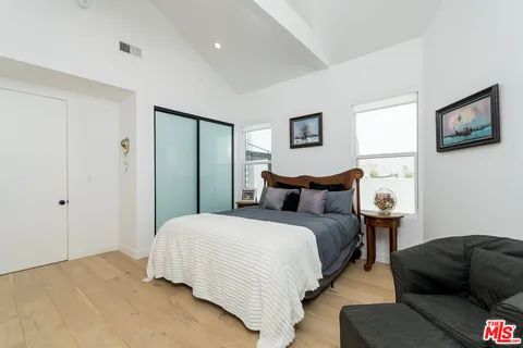 a living room with a couch and a mirror