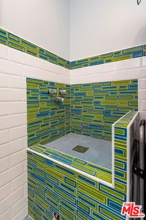 a view of a chairs and table in the balcony