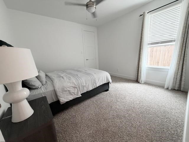 13725 Rising Sun Lane Conroe, TX 77384 - Photo 16 of 29 a bedroom with a bed and a window