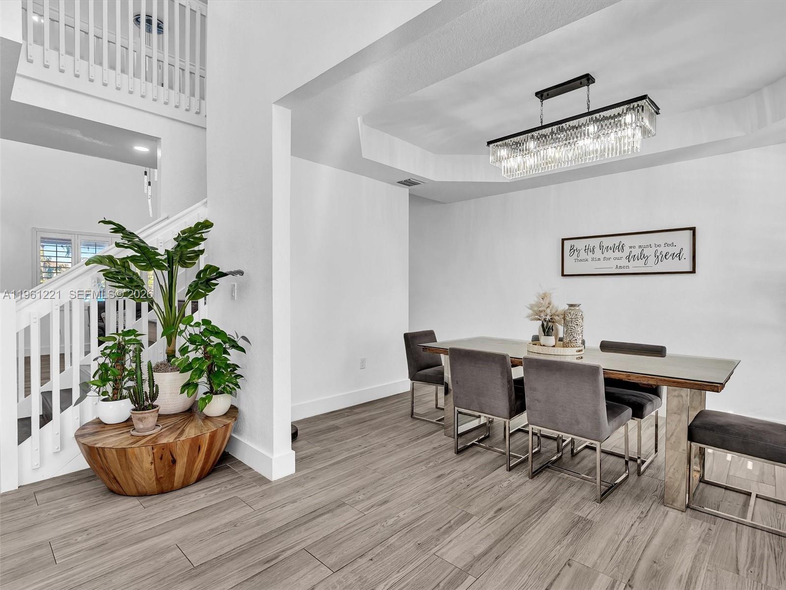 22690 Southwest 127th Court Miami, FL 33170 - Photo 11 of 52 a workspace with furniture and a potted plant
