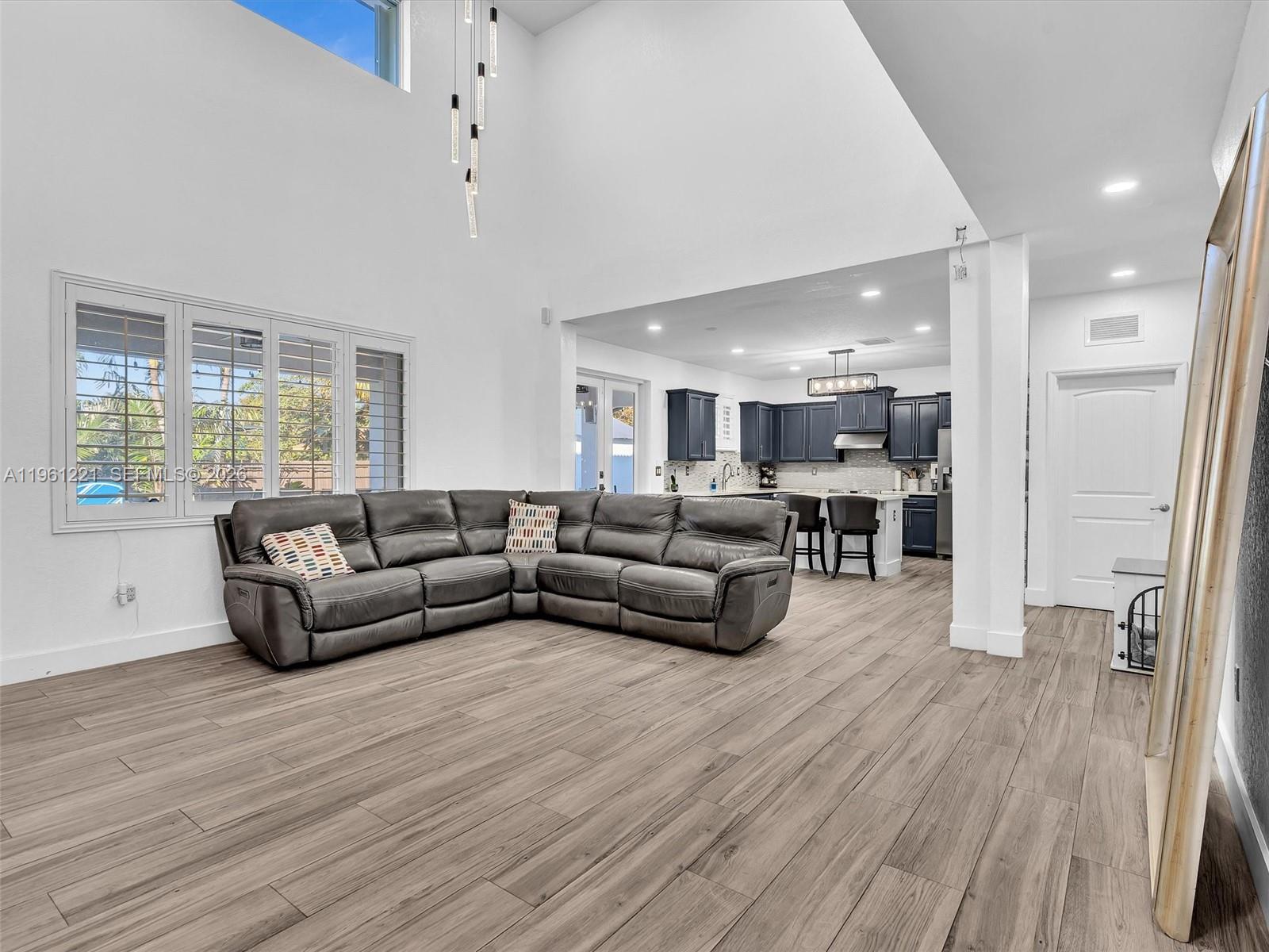 22690 Southwest 127th Court Miami, FL 33170 - Photo 13 of 52 a living room with furniture and a wooden floor