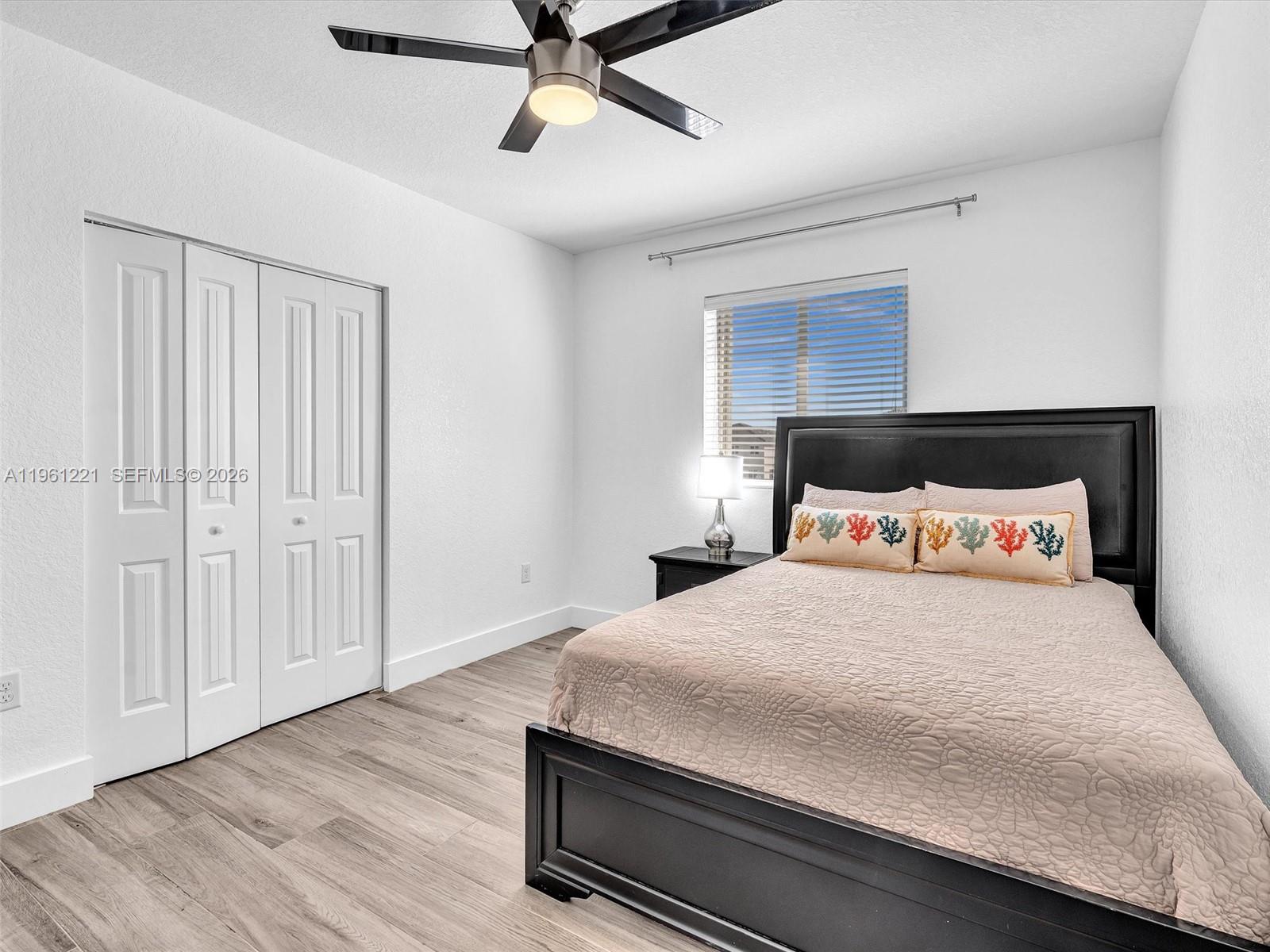 22690 Southwest 127th Court Miami, FL 33170 - Photo 28 of 52 a bedroom with a bed and a ceiling fan
