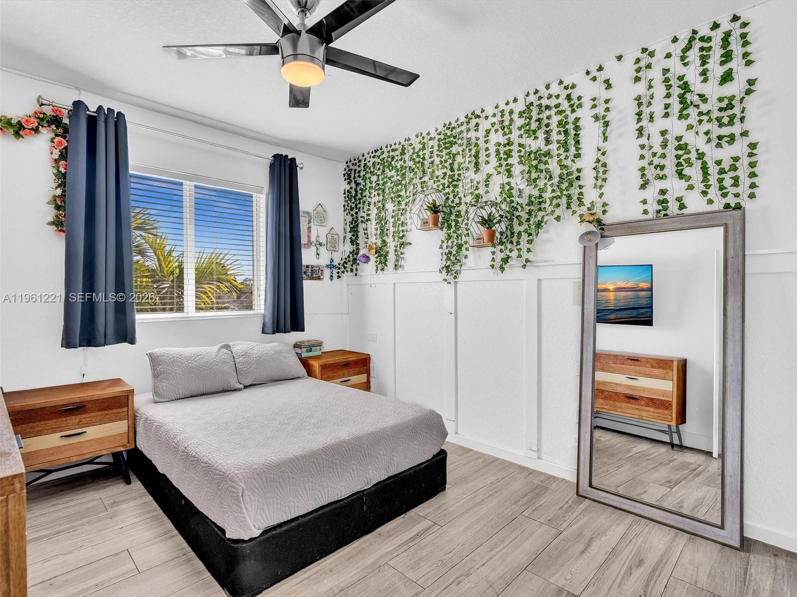 22690 Southwest 127th Court Miami, FL 33170 - Photo 29 of 52 a bedroom with a bed and a potted plant