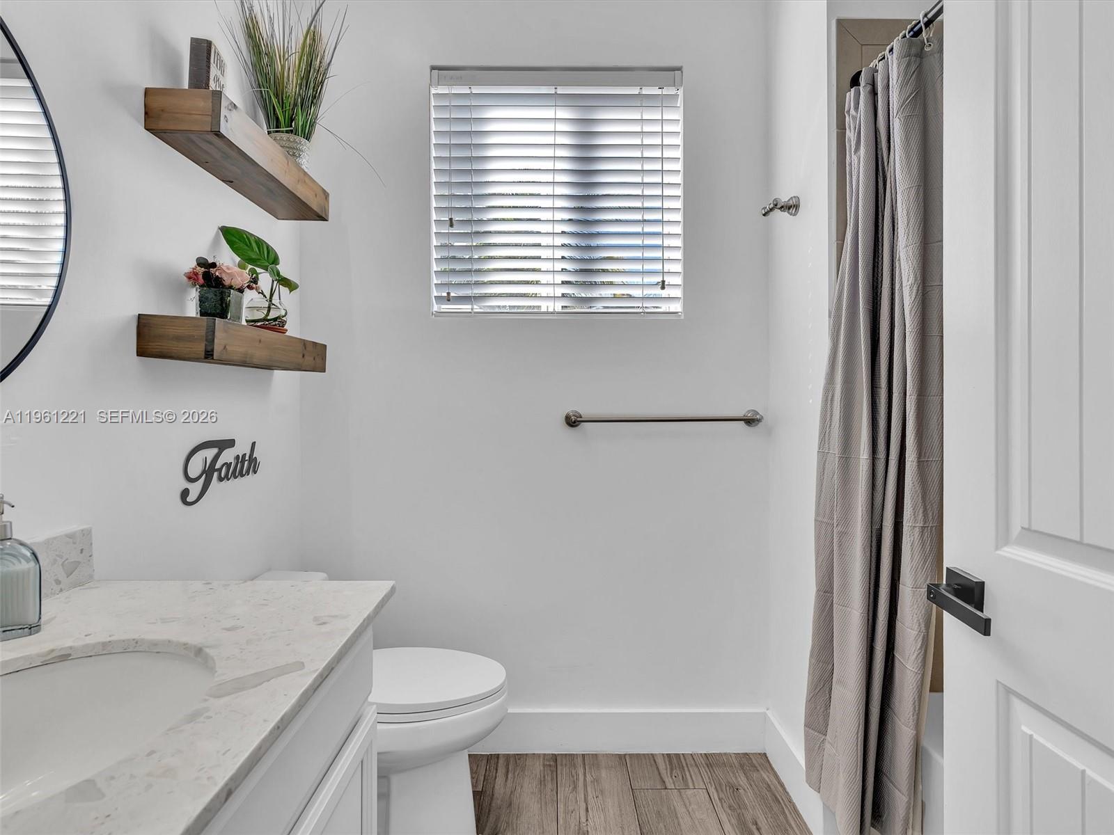 22690 Southwest 127th Court Miami, FL 33170 - Photo 34 of 52 a bathroom with a sink toilet and shower