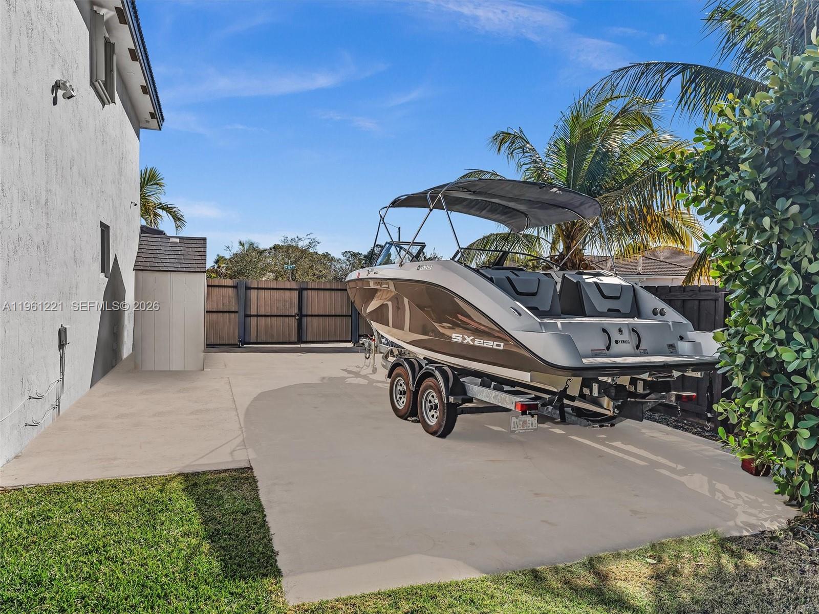 22690 Southwest 127th Court Miami, FL 33170 - Photo 41 of 52 a view of backyard with dishwasher and outdoor seating
