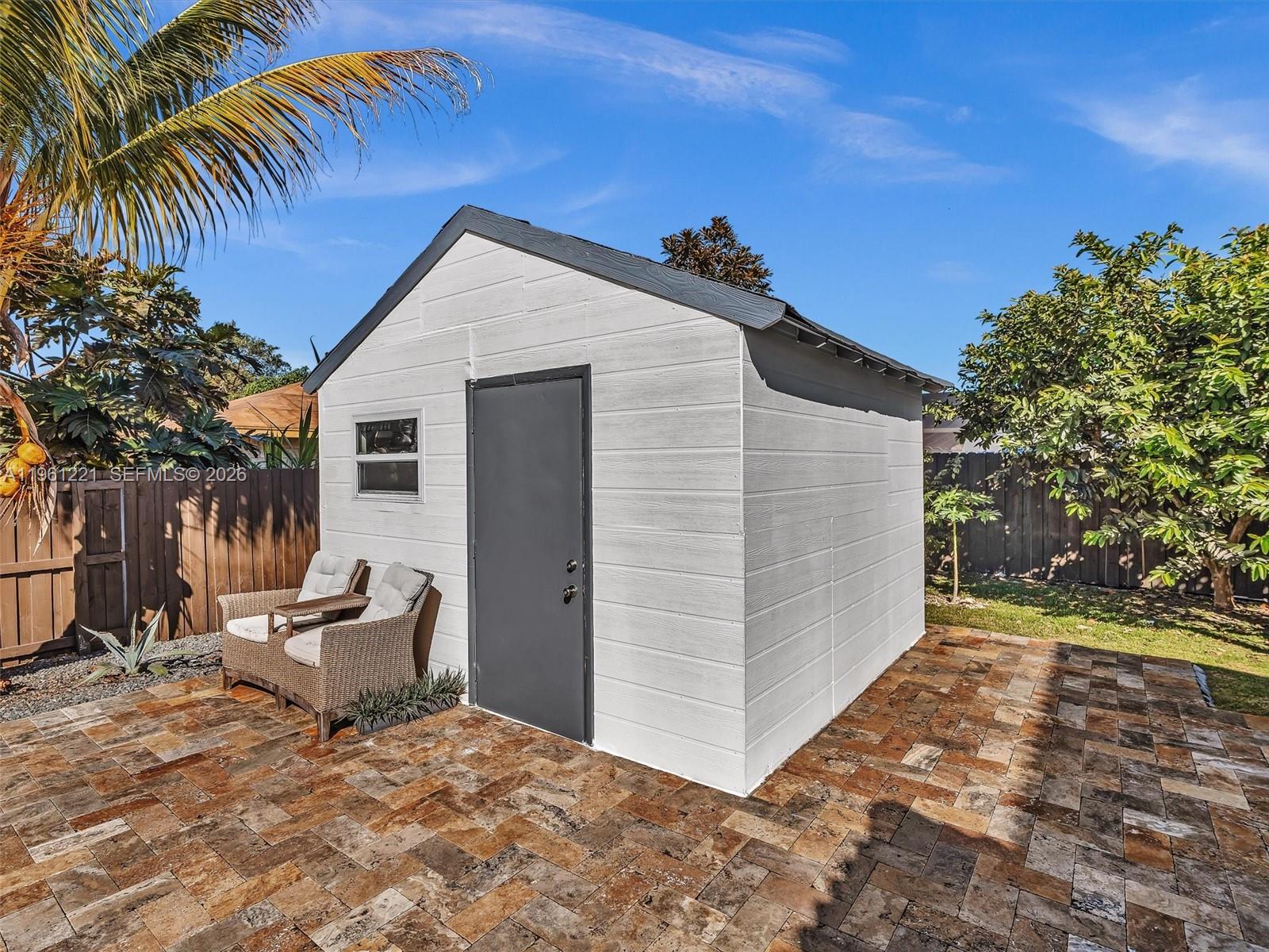22690 Southwest 127th Court Miami, FL 33170 - Photo 42 of 52 a view of a backyard with a patio