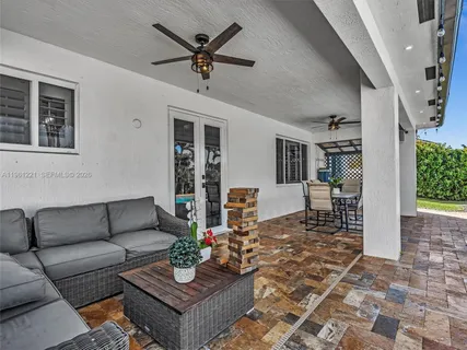 a view of a roof deck with wooden floor and fence