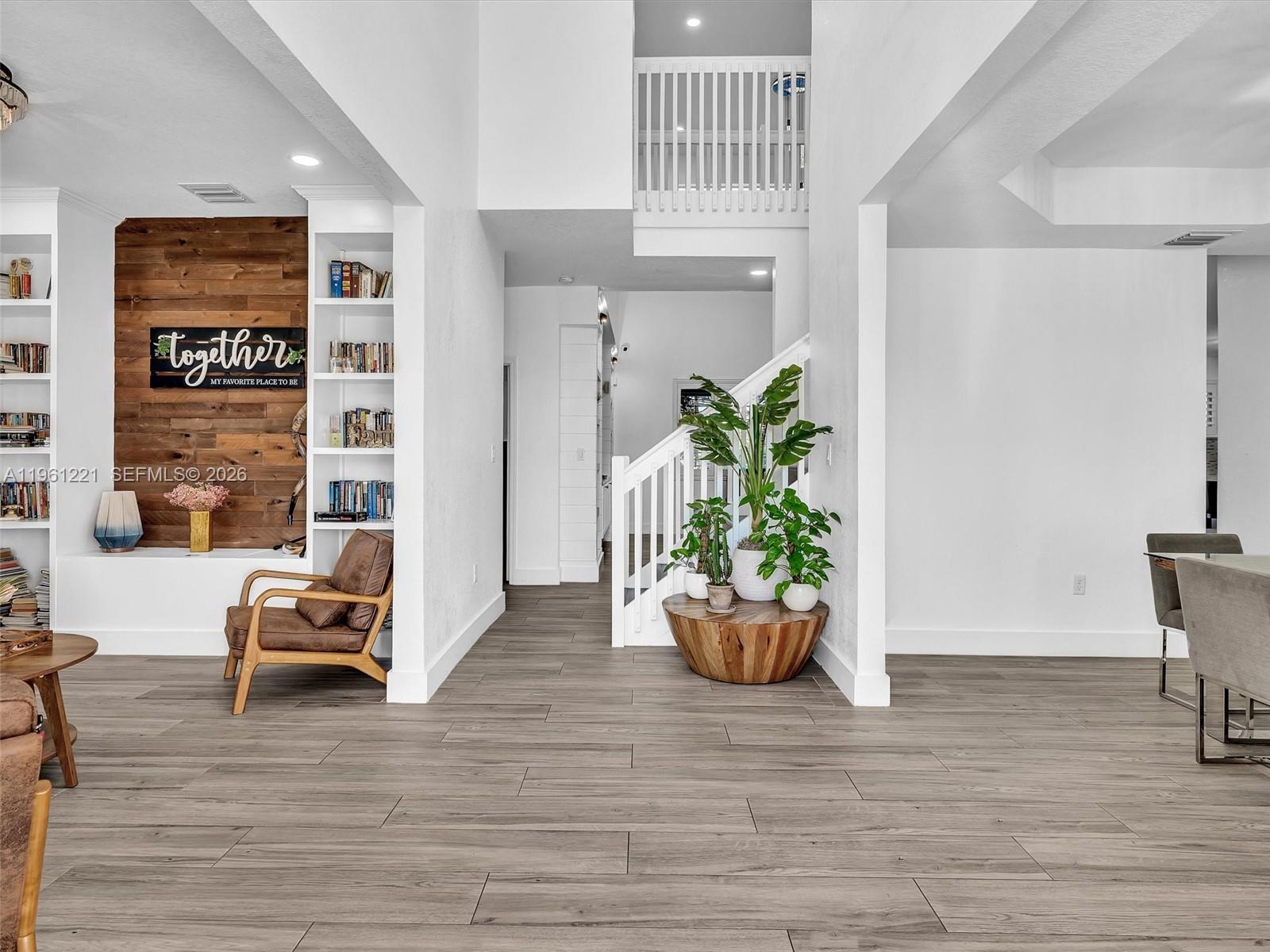 22690 Southwest 127th Court Miami, FL 33170 - Photo 8 of 52 a room with furniture and a potted plant