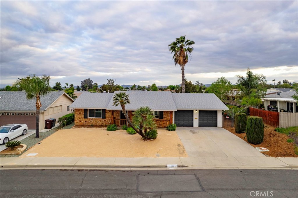 25801 Roanoke Road Menifee, CA 92586 - Photo 1 of 1 a view of a white house with a swimming pool and a yard