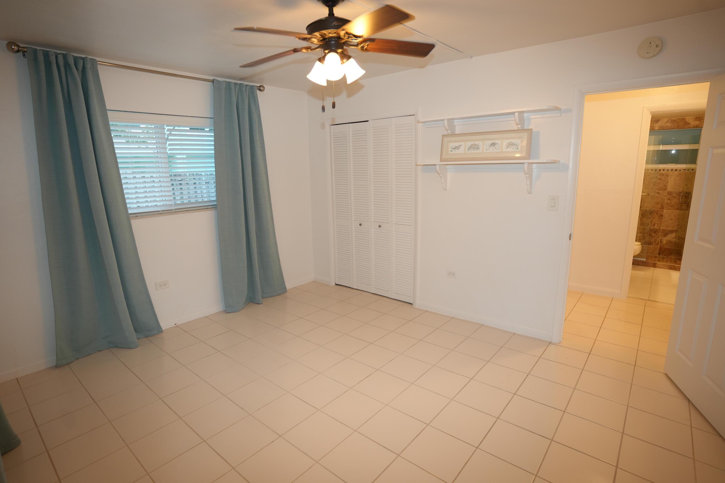 210 Schooner Lane Duck Key, FL 33050 - Photo 18 of 38 a view of a bedroom with wooden floor and cabinet