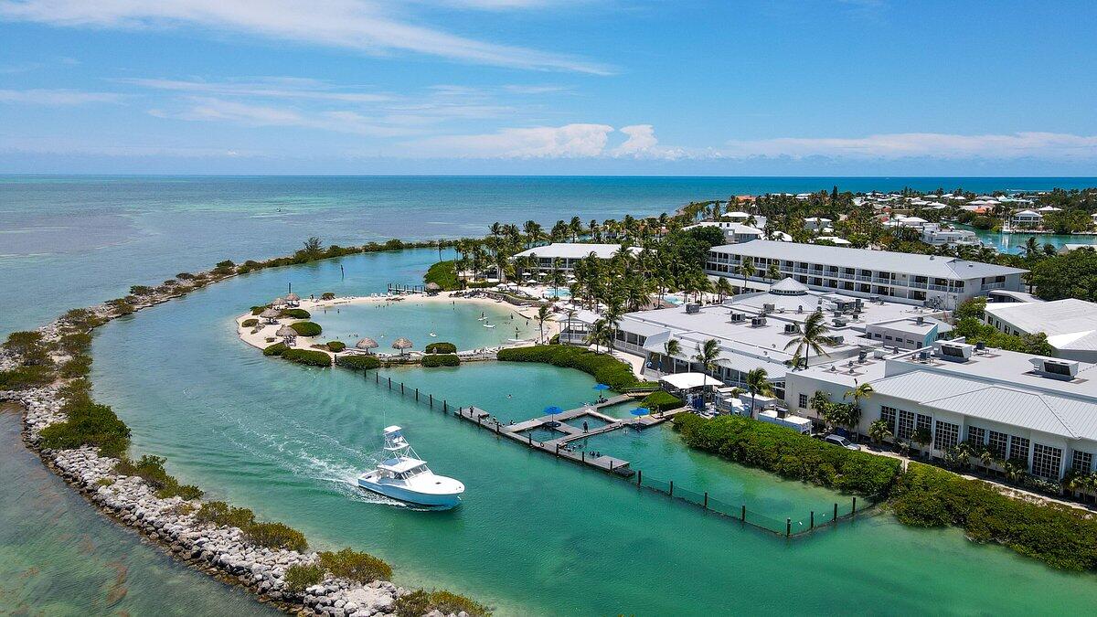 210 Schooner Lane Duck Key, FL 33050 - Photo 27 of 38 an aerial view of a city with lots of residential buildings ocean and mountain view in back