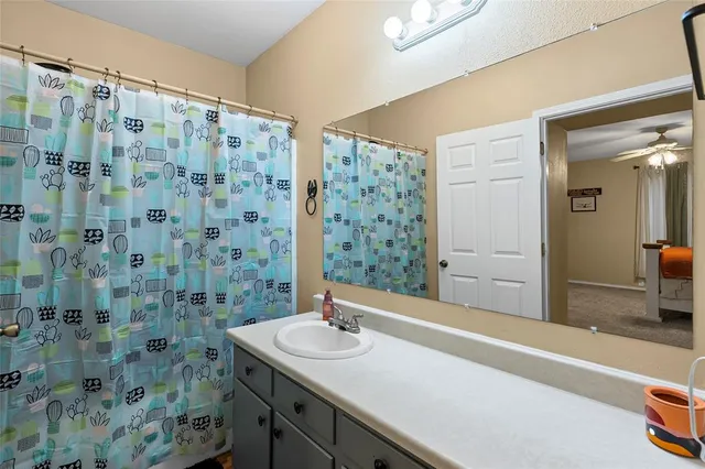 a room with a bed and a chandelier