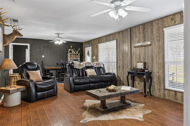 a kitchen with kitchen island granite countertop lots of counter top space and stainless steel appliances