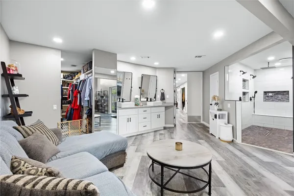 a bedroom with a bed window and couch