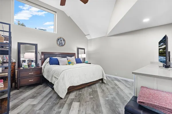 a living room with furniture and a lamp