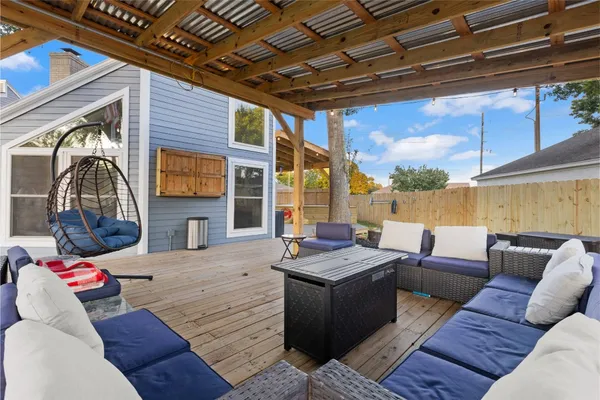 an aerial view of residential houses with outdoor space and swimming pool