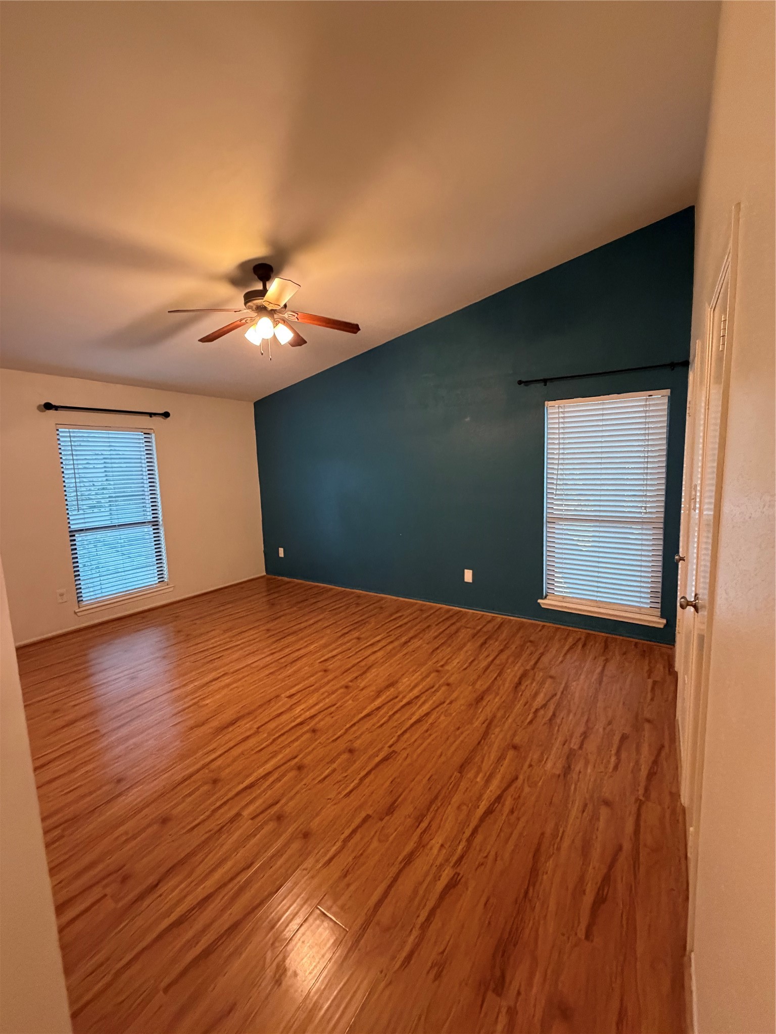 2425 Augusta Drive, Unit 36 Houston, TX 77057 - Photo 18 of 24 a view of an empty room with wooden floor and a window