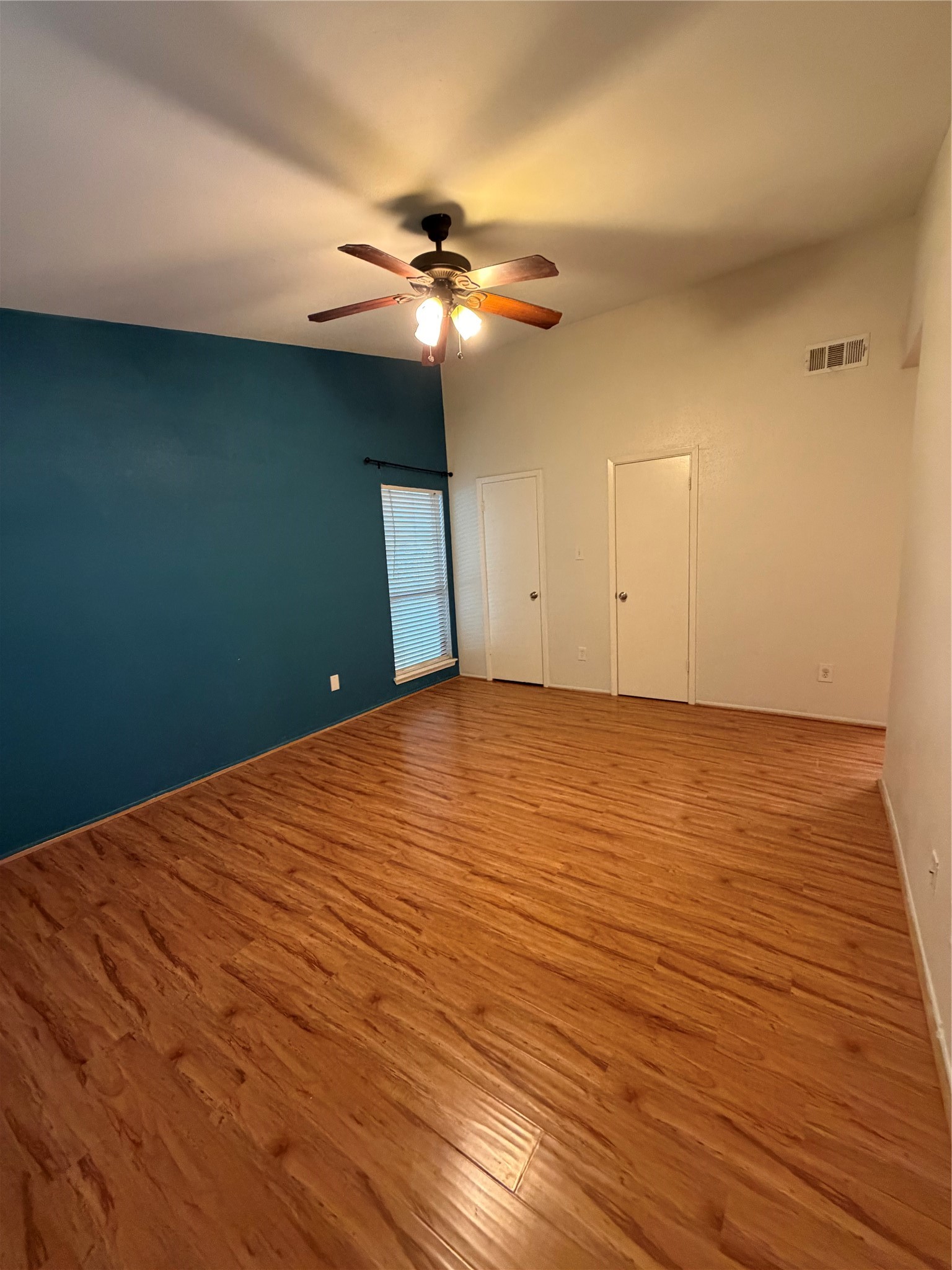2425 Augusta Drive, Unit 36 Houston, TX 77057 - Photo 19 of 24 a view of an empty room with wooden floor