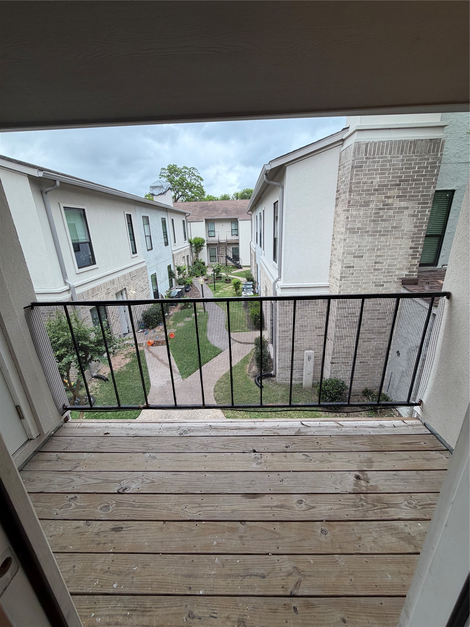 2425 Augusta Drive, Unit 36 Houston, TX 77057 - Photo 7 of 24 a view of staircase with wooden floor