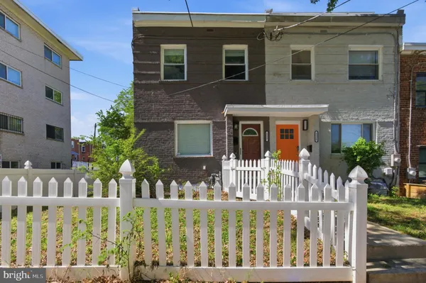 a front view of house with deck of furniture
