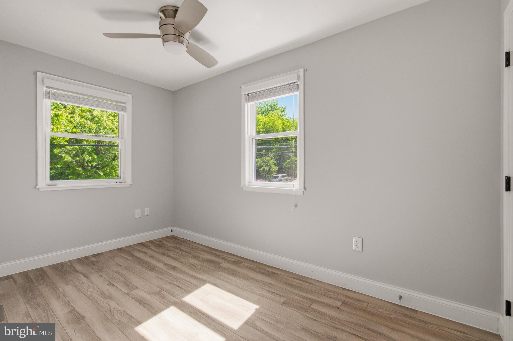 1527 Morris Road Southeast Washington, DC 20020 - Photo 18 of 22 a view of empty room with wooden floor and fan