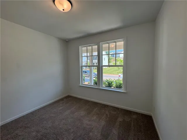 a bathroom with a toilet a sink and a mirror
