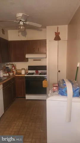 a kitchen with a stove and a refrigerator