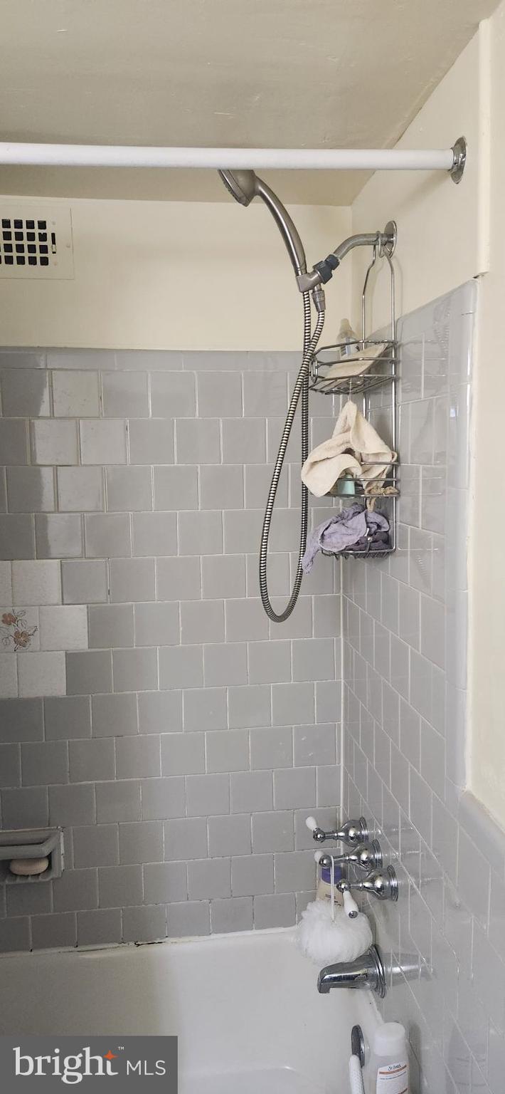 4410 Oglethorpe Street, Unit 503 Hyattsville, MD 20781 - Photo 4 of 5 a bathroom with a shower