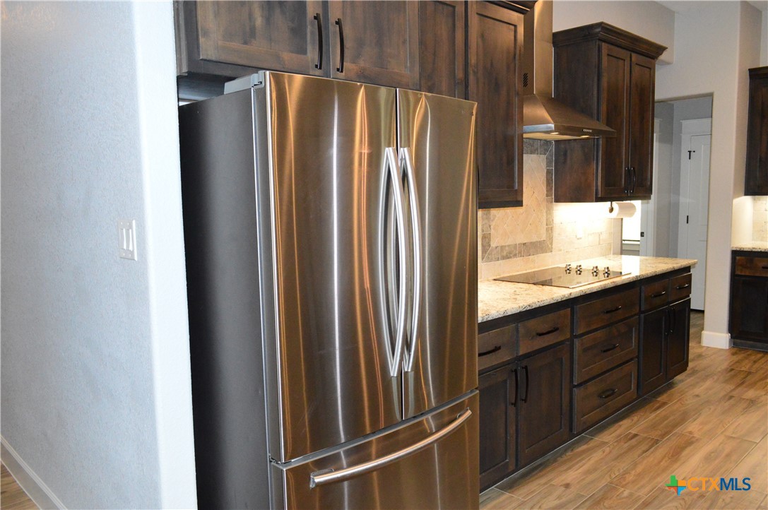 1026 County Road 3152 Kempner, TX 76539 - Photo 12 of 48 The stainless in color appliances include a built-in microwave, built-in kitchen, dishwasher, glass cooktop, and the freezer-on-the bottom refrigerator is included.