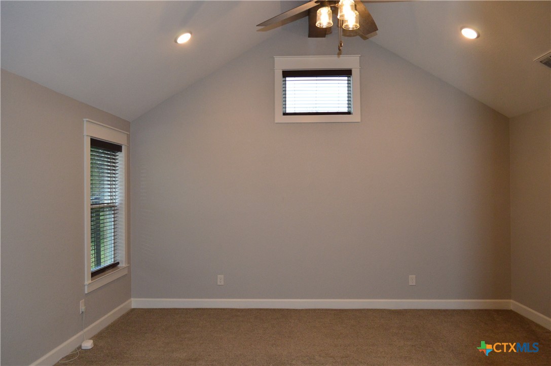 1026 County Road 3152 Kempner, TX 76539 - Photo 17 of 48 an empty room with a window and a chandelier fan