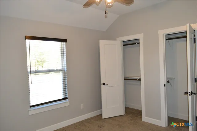 a bathroom with a shower and a glass door