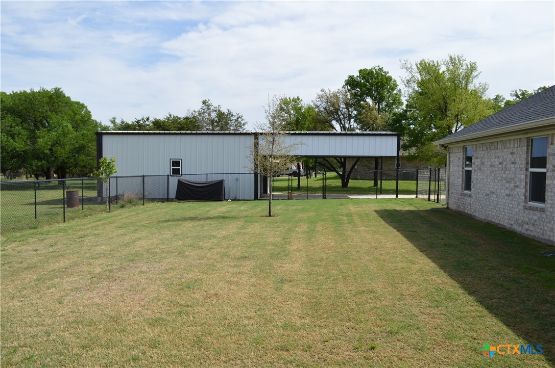 1026 County Road 3152 Kempner, TX 76539 - Photo 34 of 48 Fenced, Flat Back Yard Looking Toward the Shop * Dog run that could be a garden * The lot goes further back than the fence.