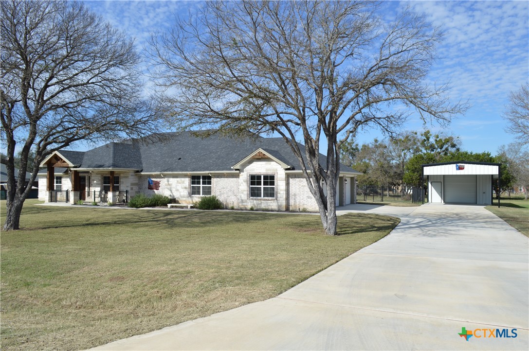 1026 County Road 3152 Kempner, TX 76539 - Photo 4 of 48 Concrete Driveway Leading to the Three Car, Side-Entry Garage and the 20' X 30' Insulated Shop with Electricity and Attached 20' X 25' Carport