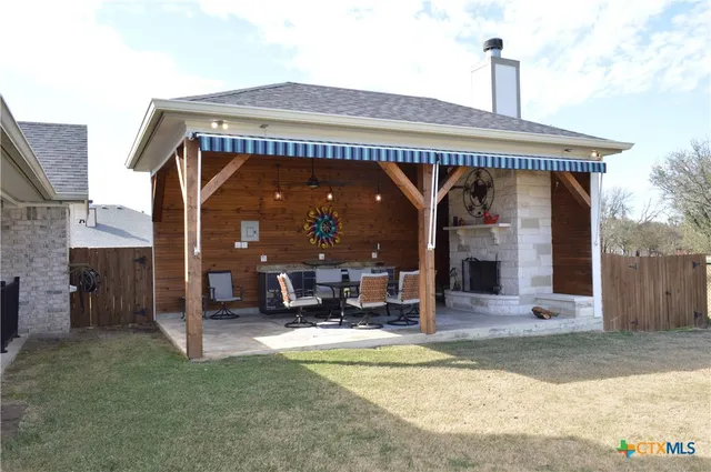 a living room with furniture a fireplace and a table