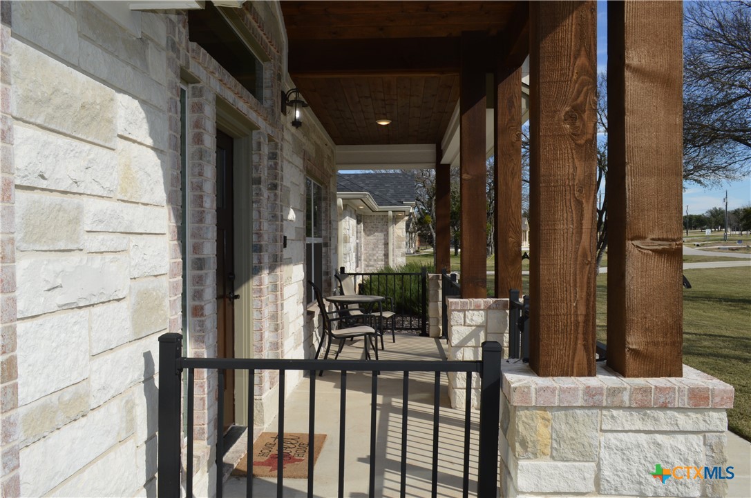1026 County Road 3152 Kempner, TX 76539 - Photo 41 of 48 22' 10" X 6' Covered Front Porch ** Four Sides Brick with Texas Stone Trim on the Front