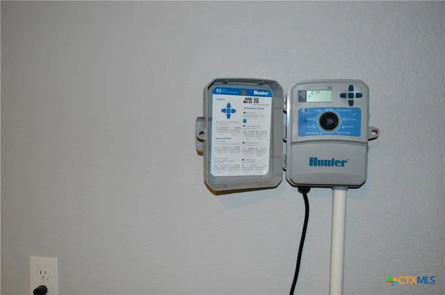 a view of a patio with table and chairs