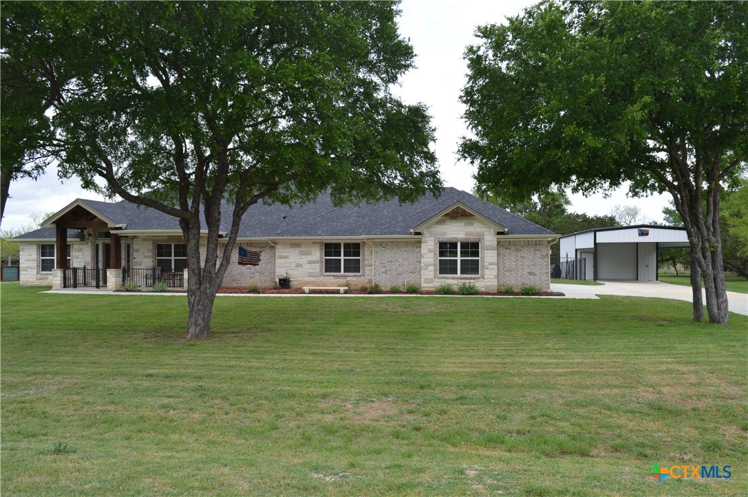 1026 County Road 3152 Kempner, TX 76539 - Photo 43 of 48 a front view of a house with a garden