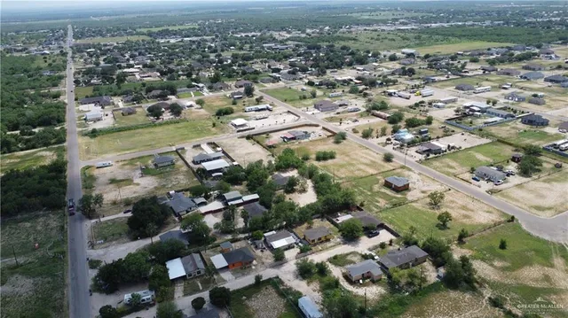 an aerial view of a house with a garden