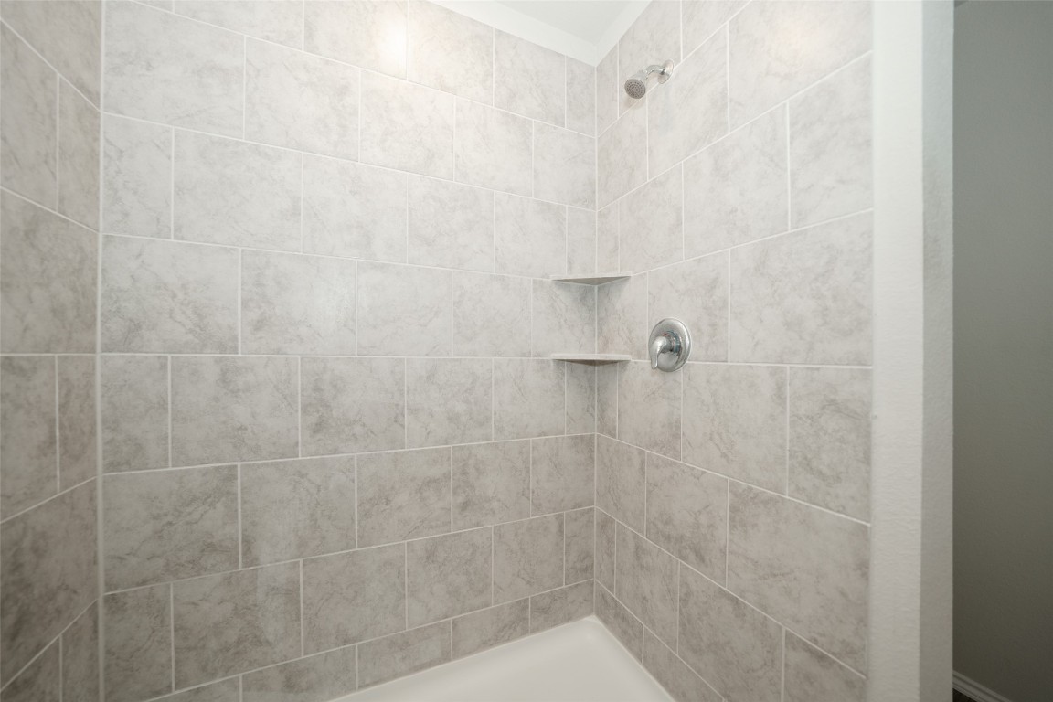 2407 Divot Lane Navasota, TX 77868 - Photo 25 of 37 a bathroom with a shower