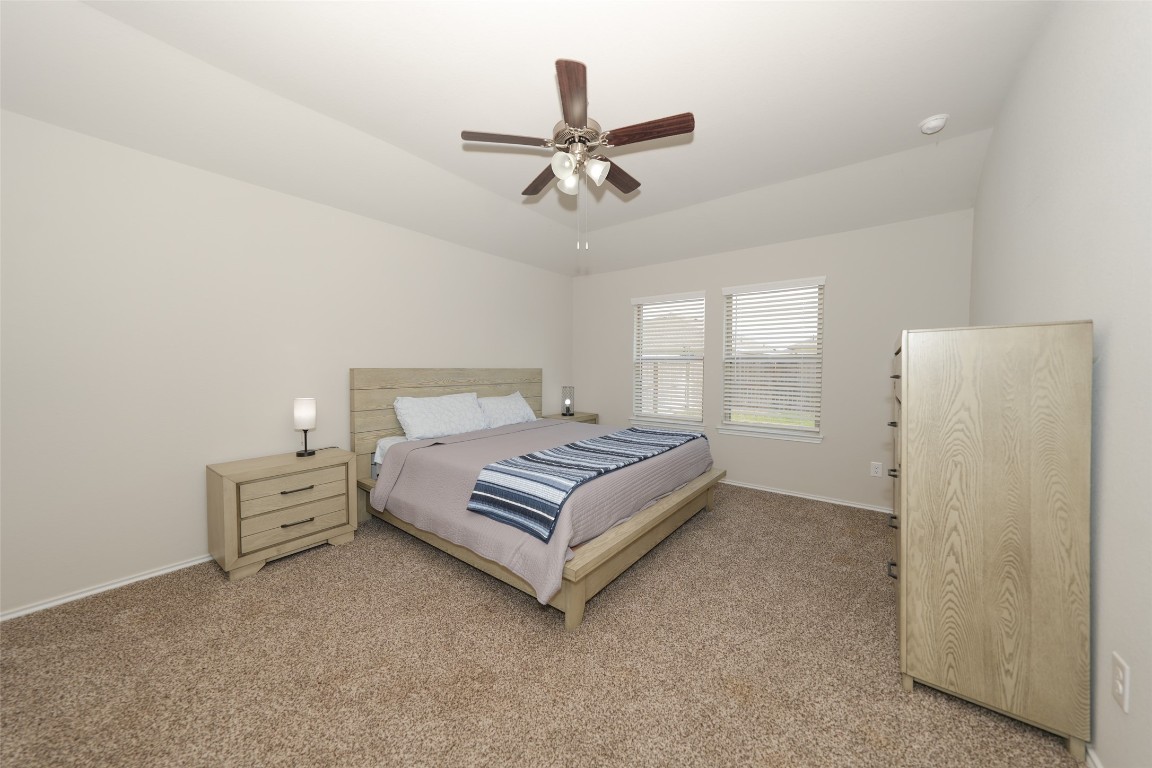 2407 Divot Lane Navasota, TX 77868 - Photo 31 of 37 a bedroom with a bed and window