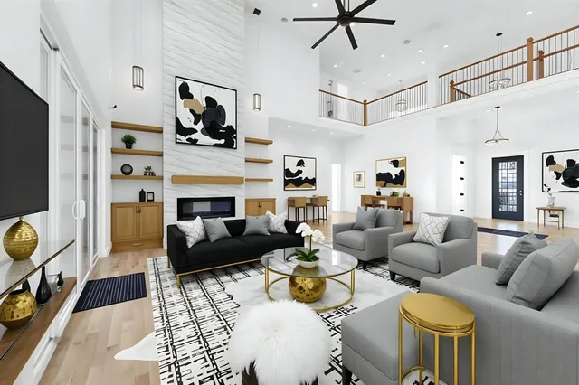 a view of empty room with wooden floor and fireplace