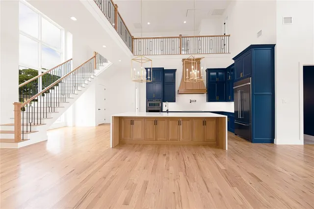 a open kitchen with a table and chairs