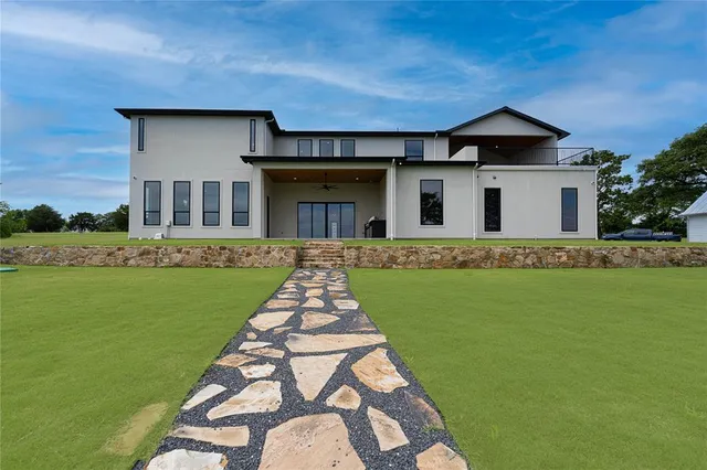 a view of a lake with a yard